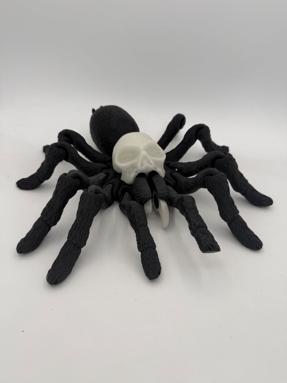 XL Black with Blue Glow spider, just over 10 inches